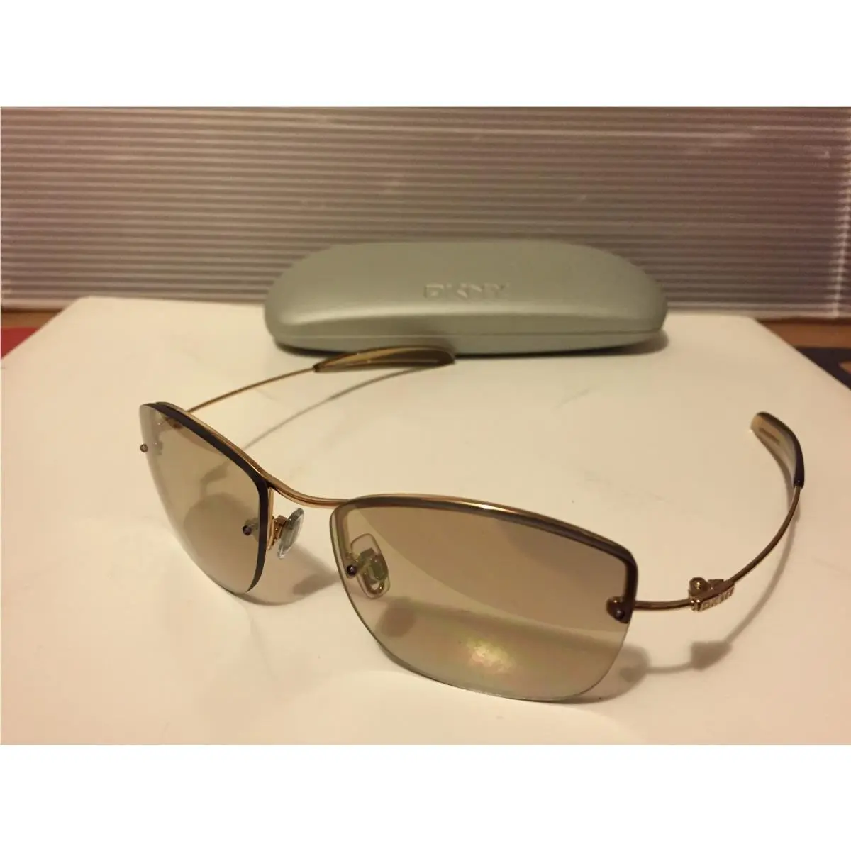 Dkny 7255S 715 Sunglasses Gold / Bronze with Lite Black Mirror Lens