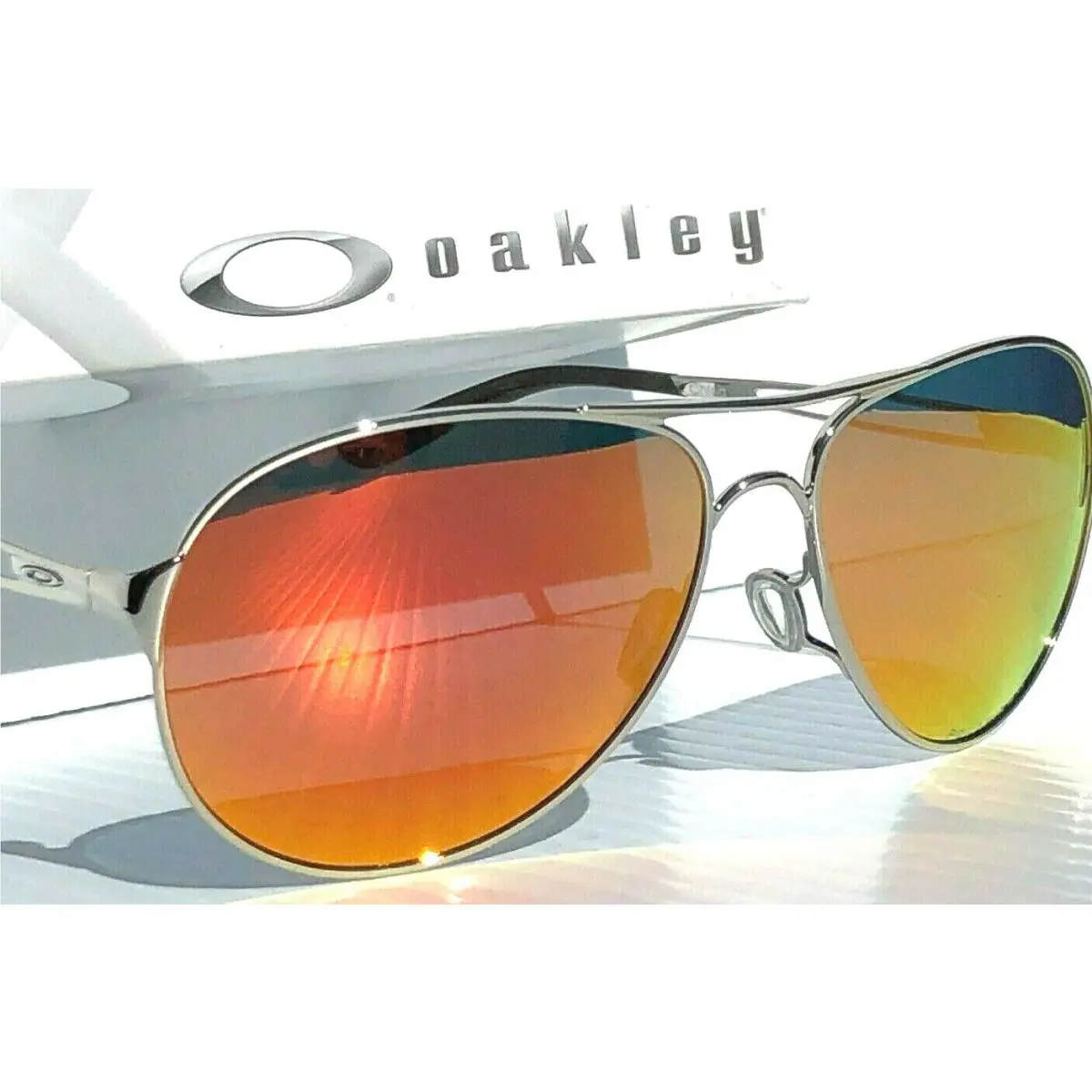 Caveat Silver Polarized Ruby Womens 60mm Aviator Sunglass 4054 by Oakley