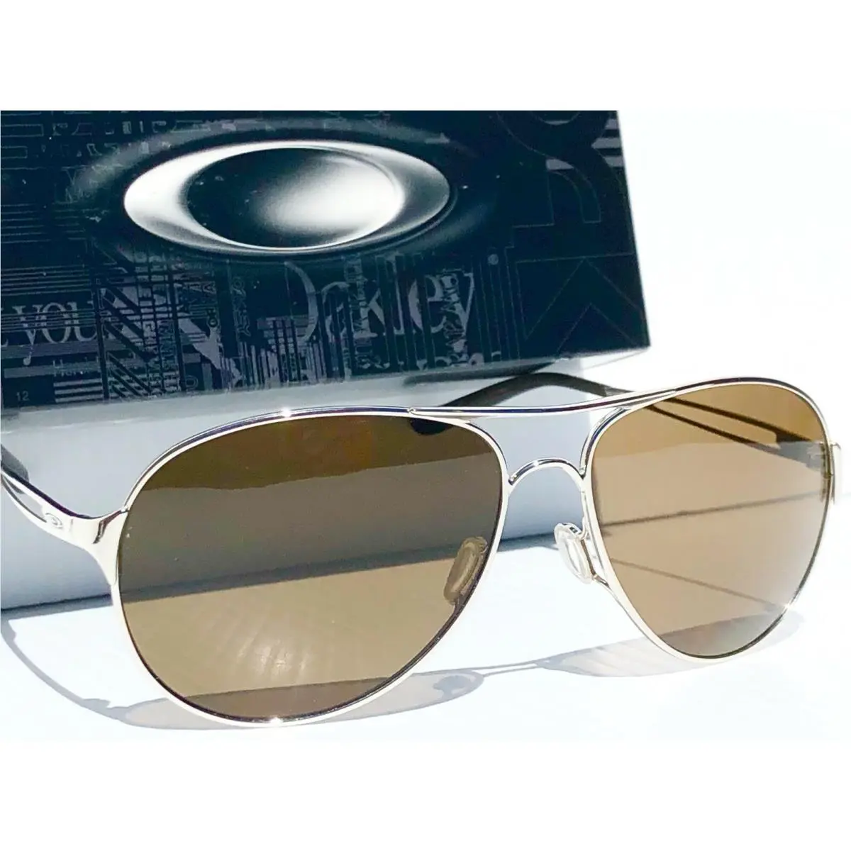 Oakley Caveat Silver Polarized Galaxy Brown Women`s Aviator Sunglass 4054