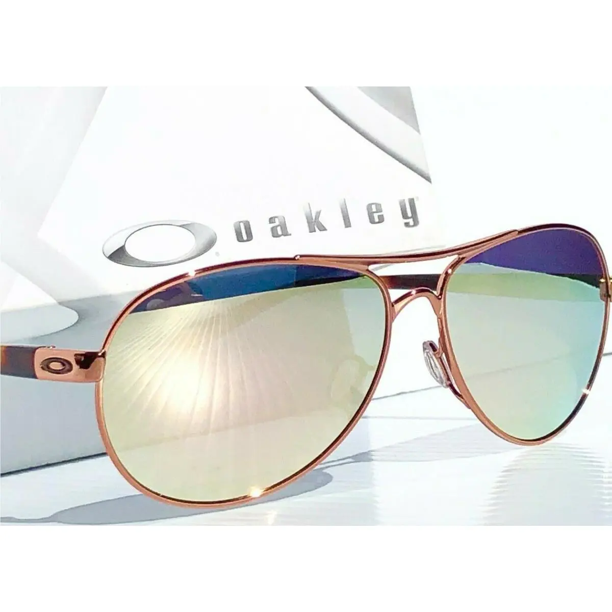 Feedback Rose Gold Polarized Galaxy Rose Mirror Aviator Women`s Sunglass by Oakley