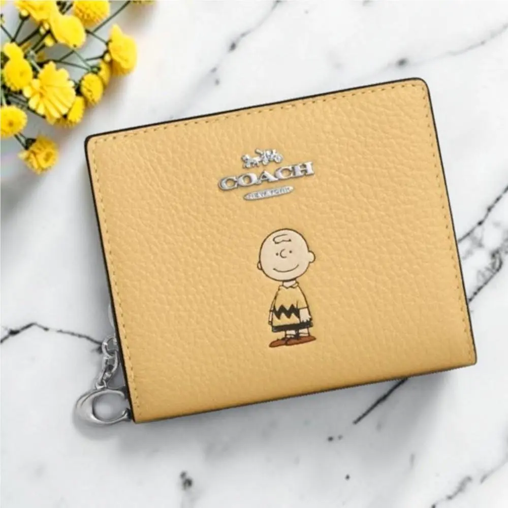 Coach X Peanuts Leather Snap Wallet with Charlie Brown in Yellow CBN90