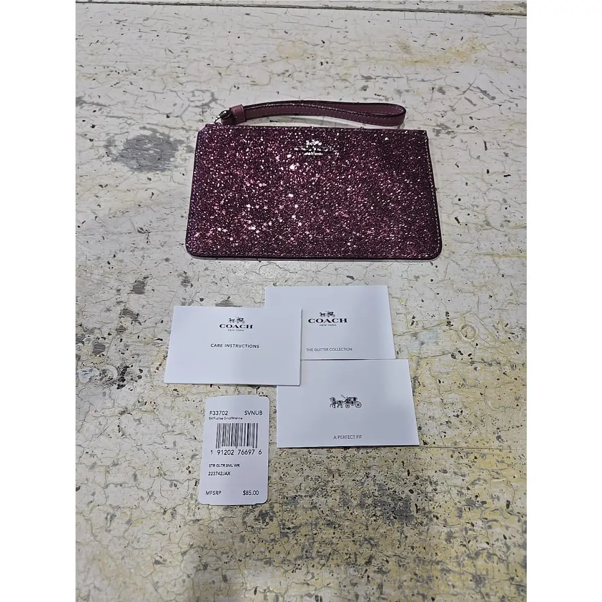 Coach Glitter Small Wristlet in a Fuchsia or Burgundy