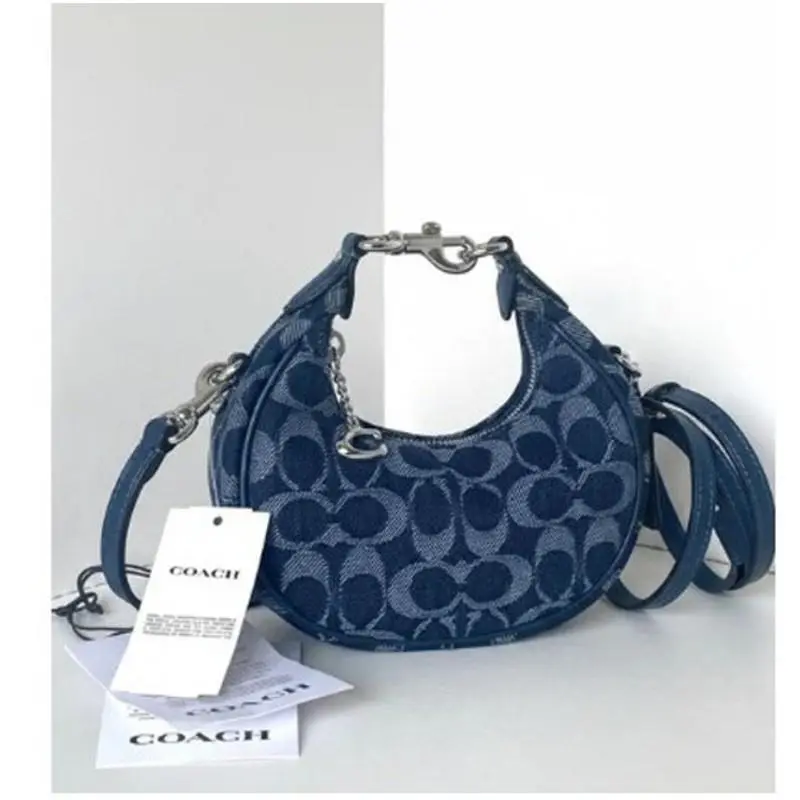 CAO04 Jonie Crossbody Wristlet Bag Deep Blue Multi Signature Denim by Coach