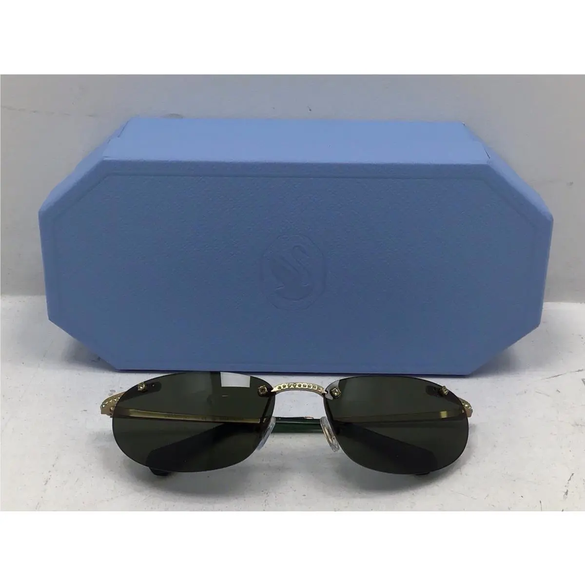Swarovski Women’s Round Green Rimless Sunglasses with Diamonds