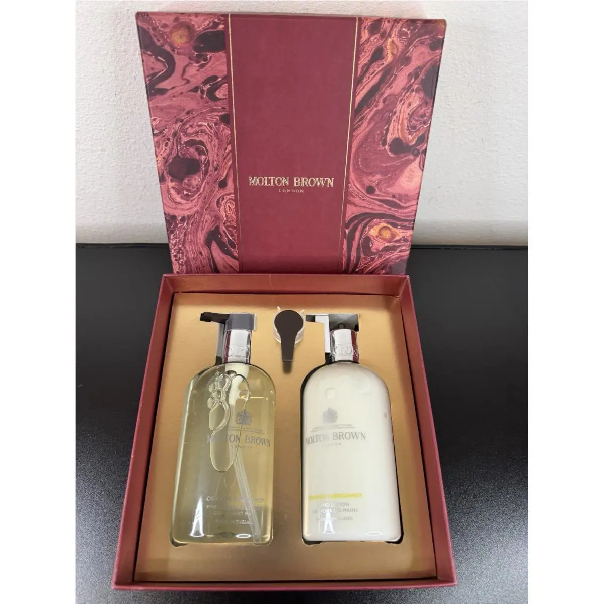 Molton Brown Orange Bergamot Hand Care Collection Hand Lotion Top Broken