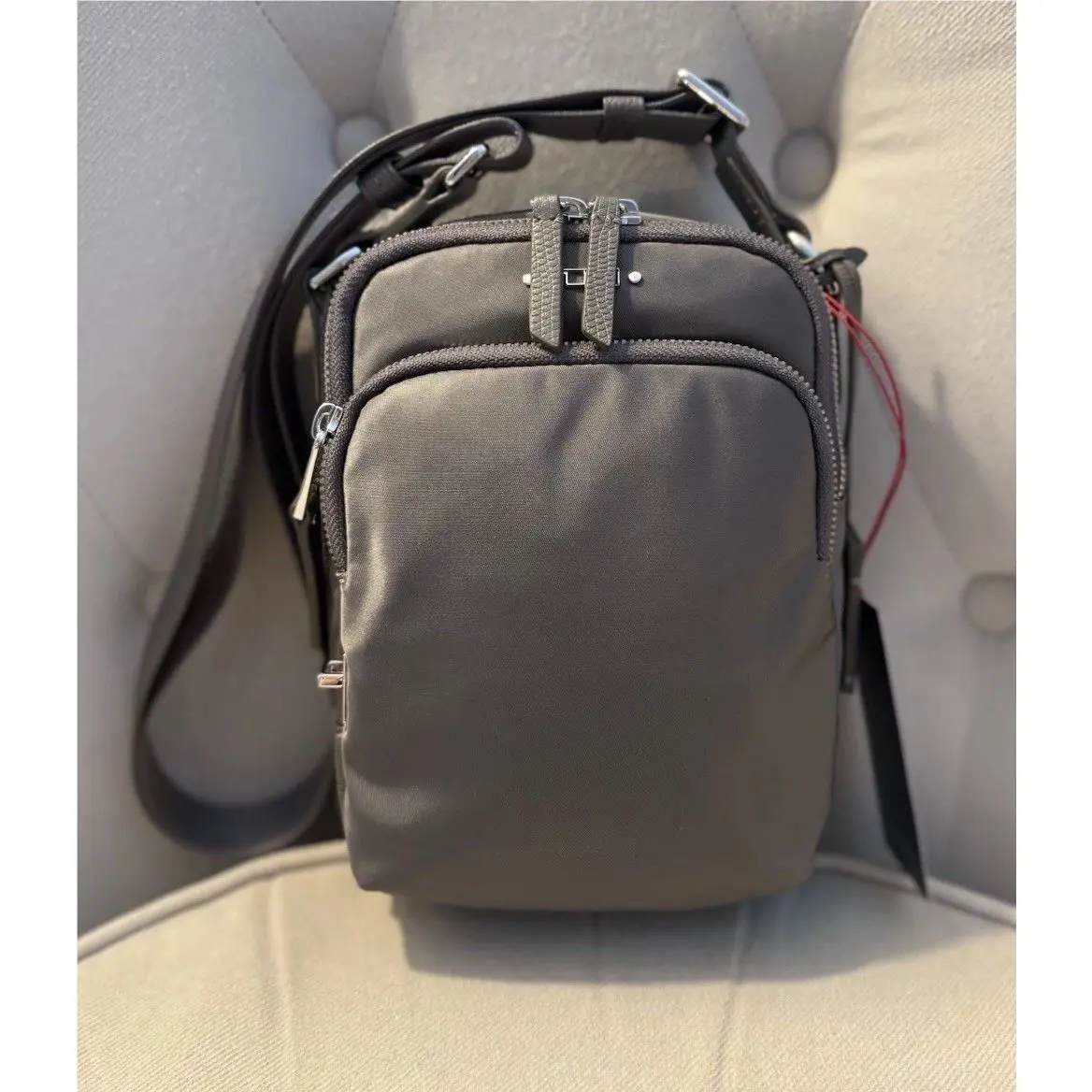 Tumi Rama Crossbody Bag NWT$175 Zinc Grey Color