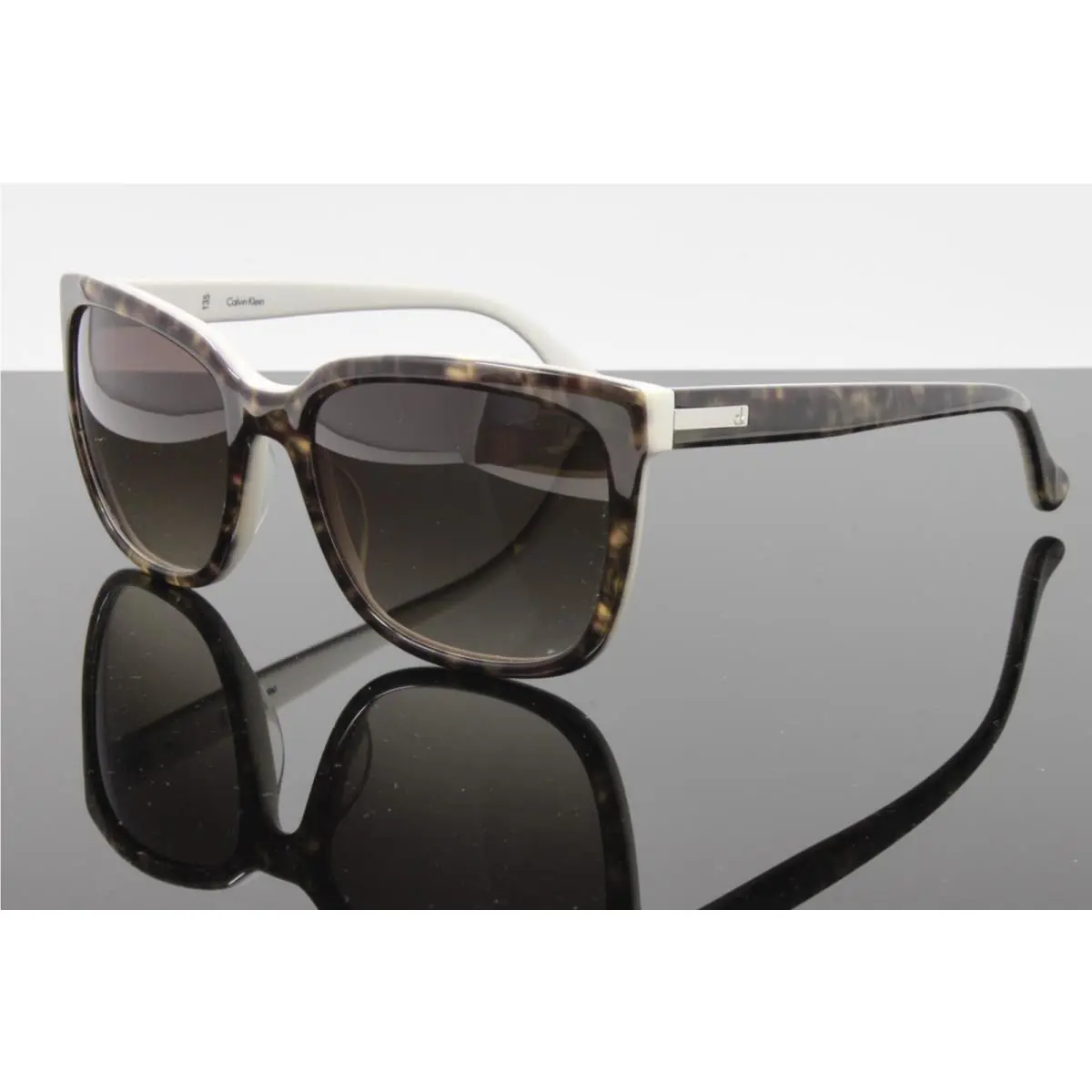 CK Calvin Klein Women`s Sunglasses CK4253S 260 Havana White 55mm Brown Lens
