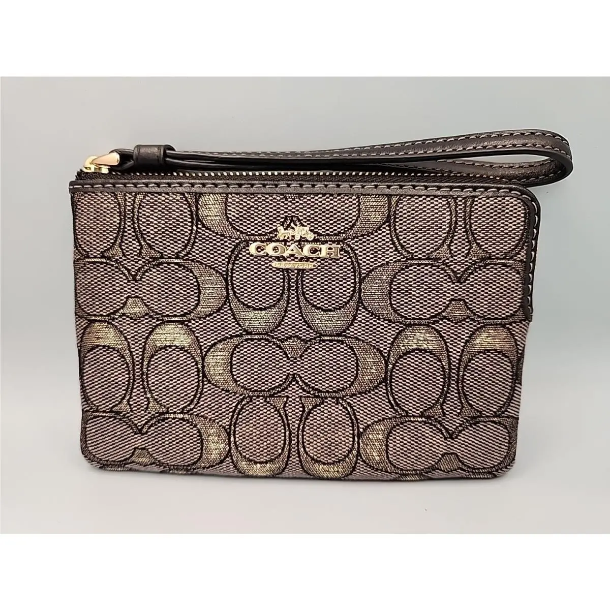 Coach Corner Zip Wristlet in Signature Jacquard CCL22. Charcoal Gold