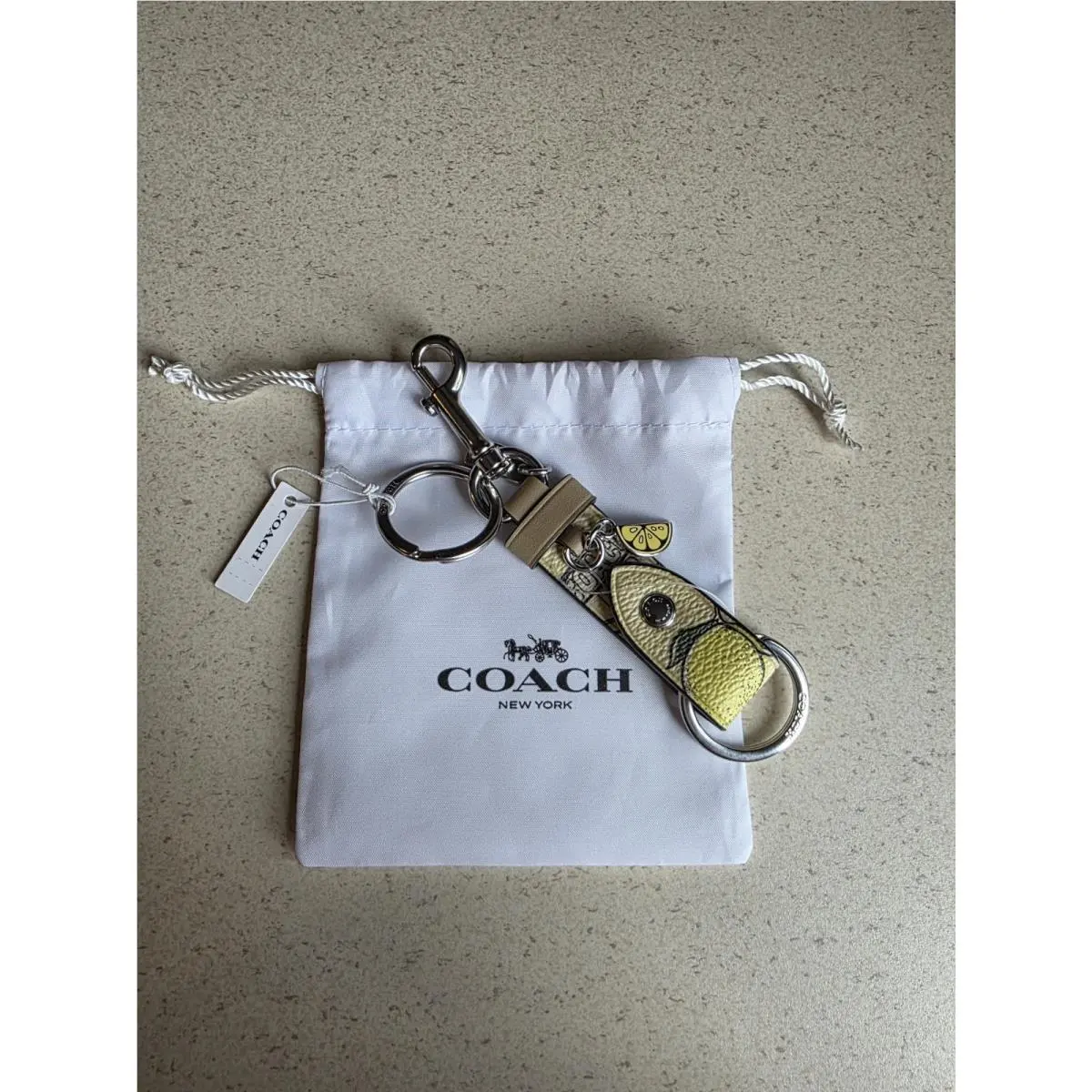 Coach Trigger Snap Bag Charm with Lemon Print with Dust Bag