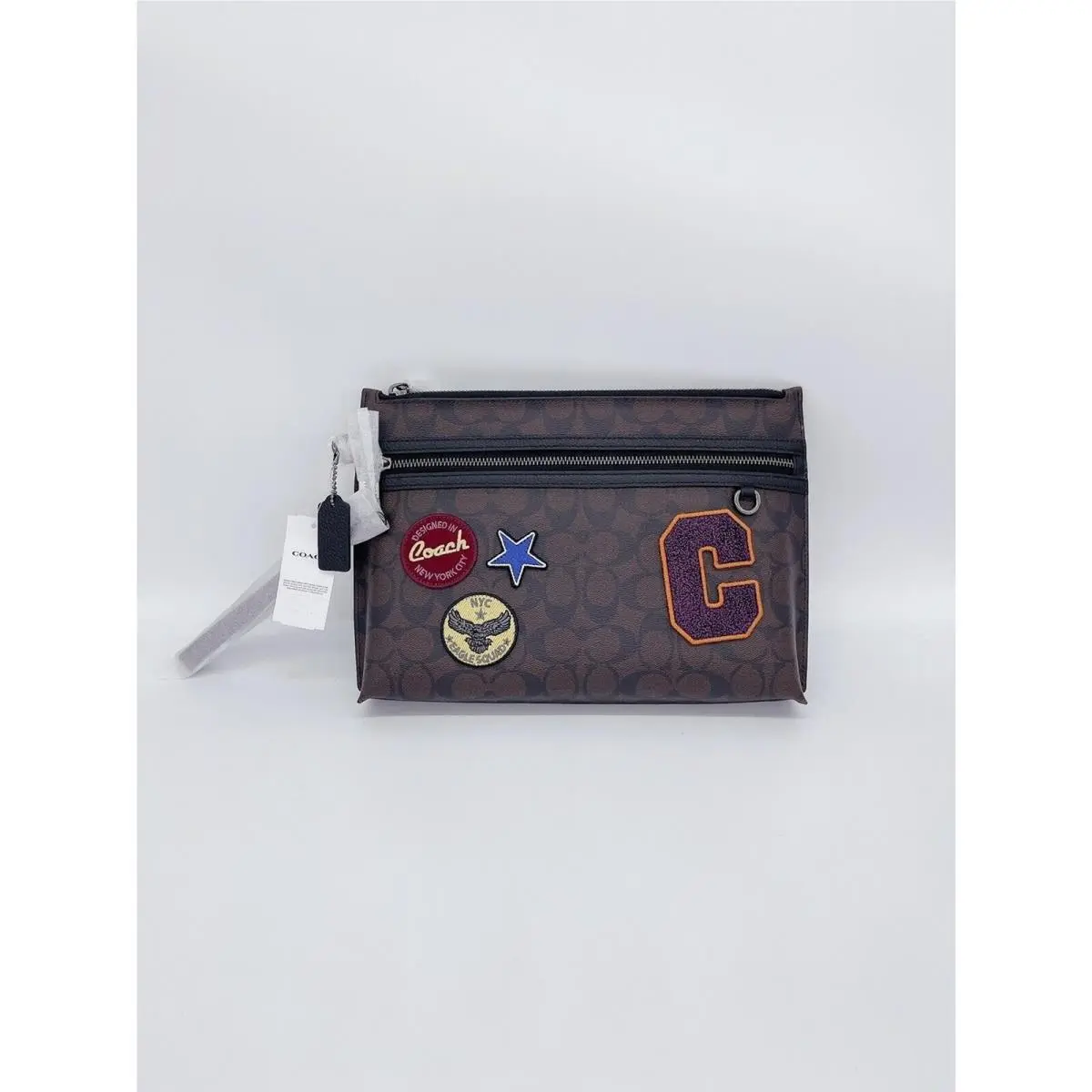 C6990 Carry All Pouch In Signature Canvas with Souvenir Patches by Coach