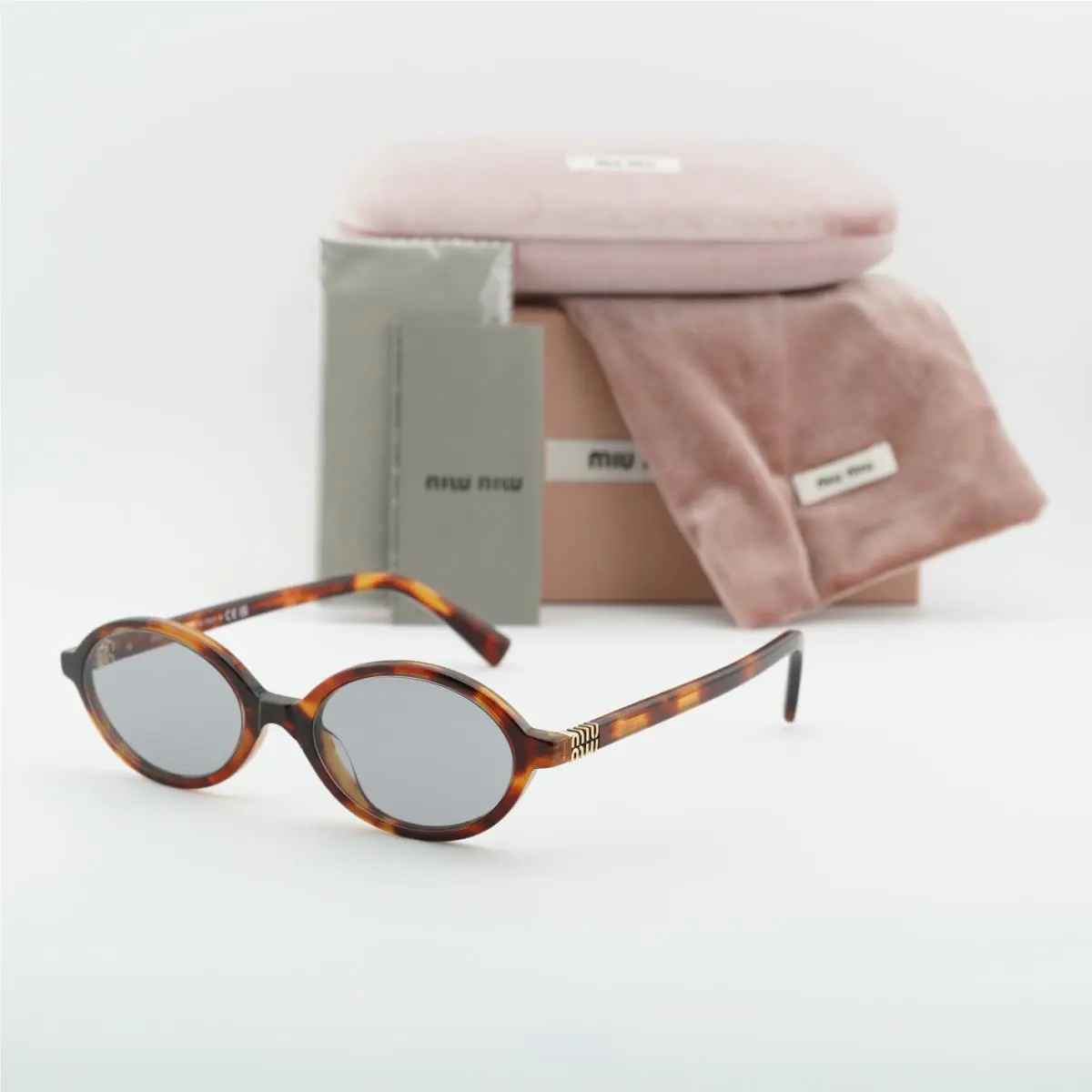 Miu Miu MU04ZS 21C40O Havana Mahogany/grey 50-18-140 Sunglasses