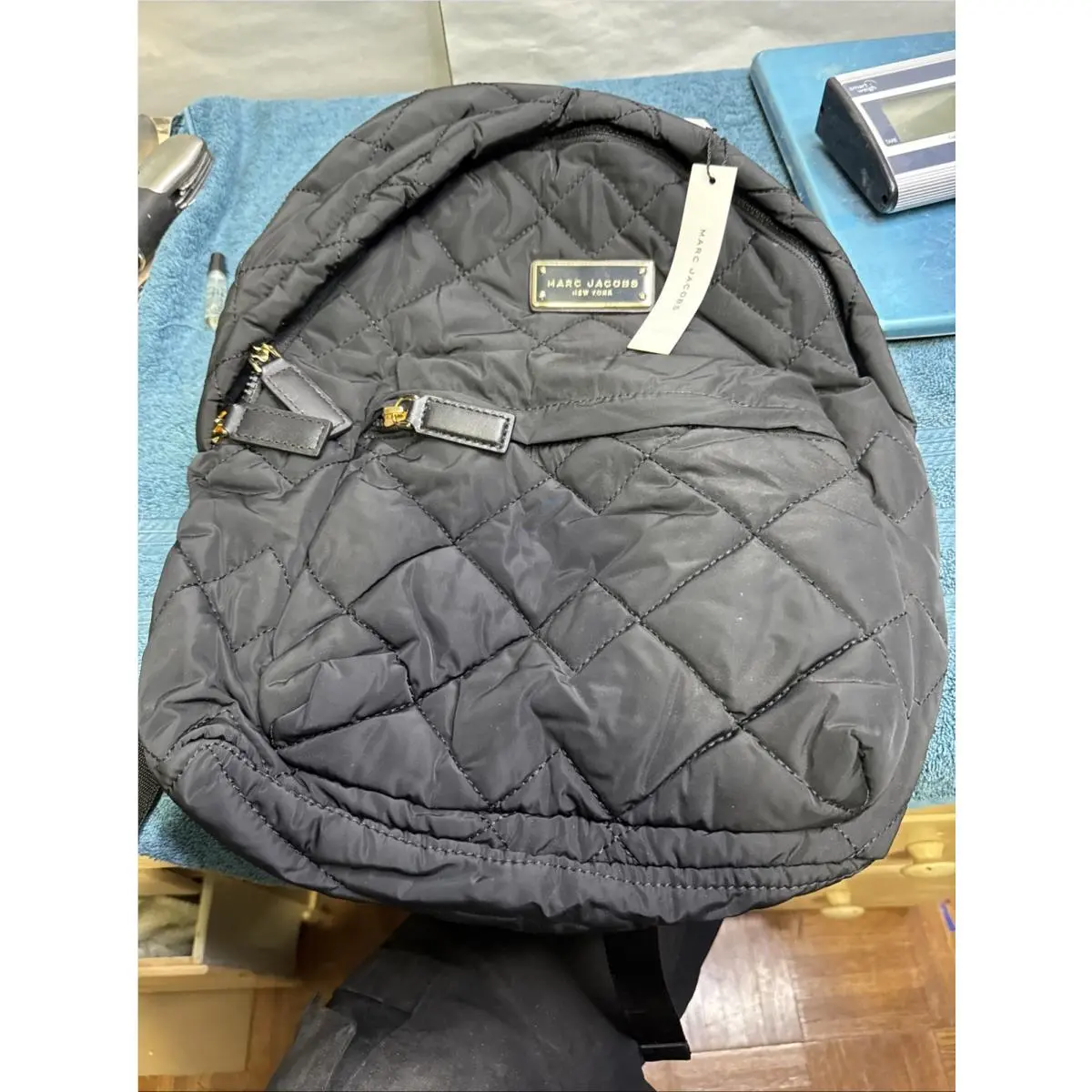 Marc Jacobs Women’s Black Quilted Backpack with Zipper Logo Plaque