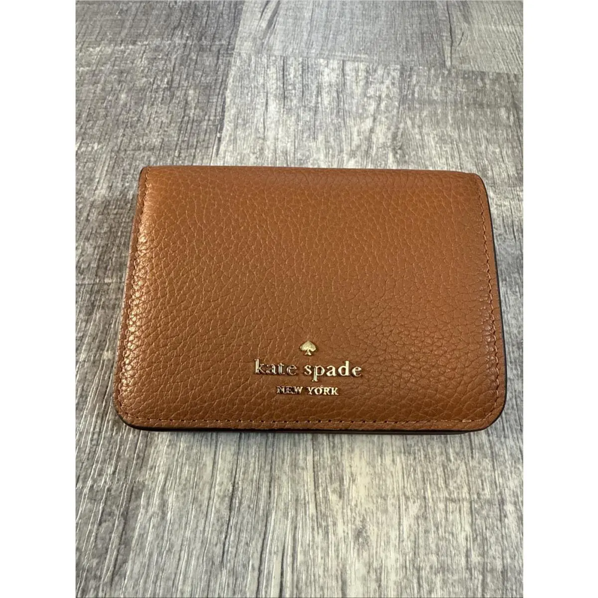 Kate Spade Kayla Pebbled Leather Small Bifold Wallet Brown