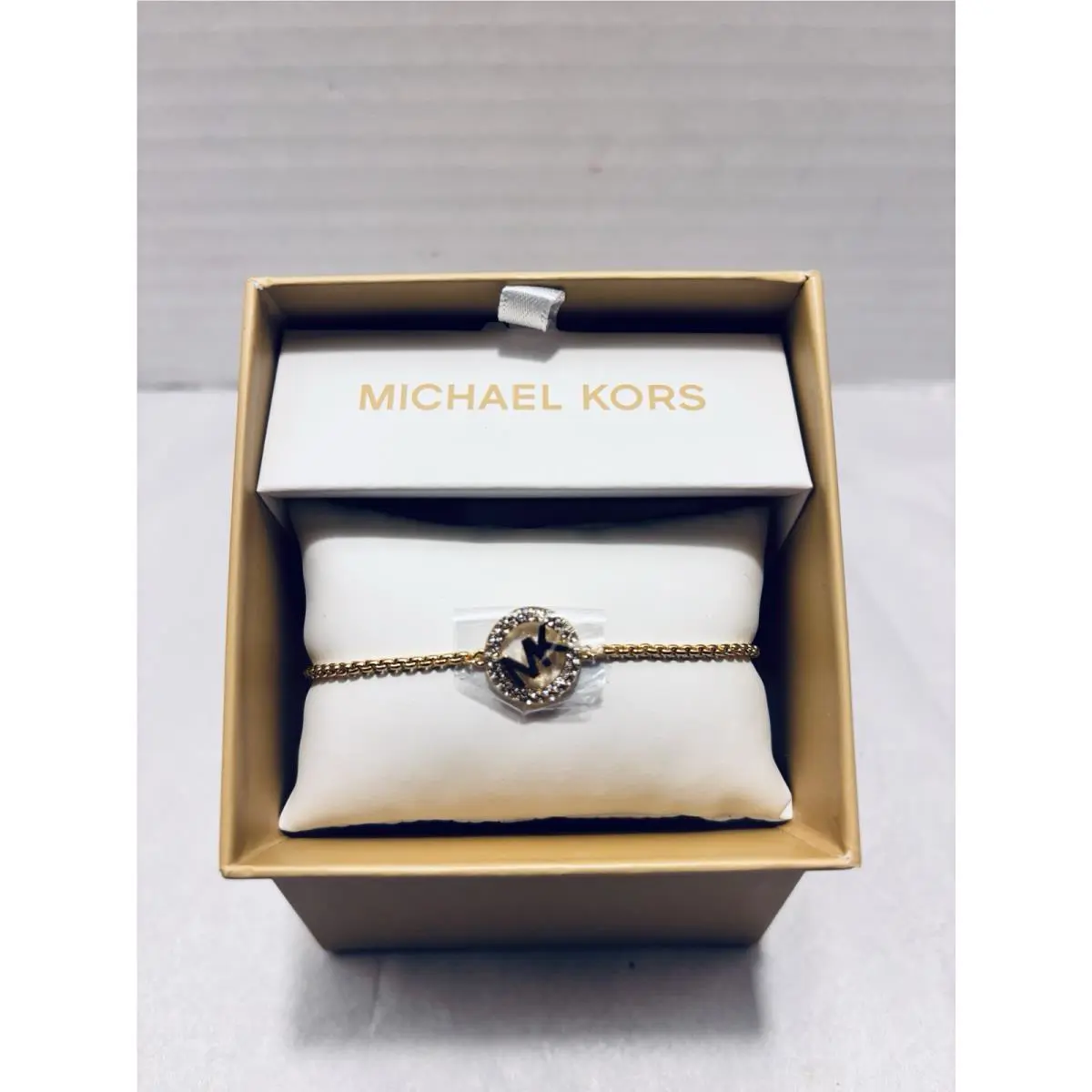Michael Kors Gold Tone Brass MK Logo Crystal Station Bracelet Box