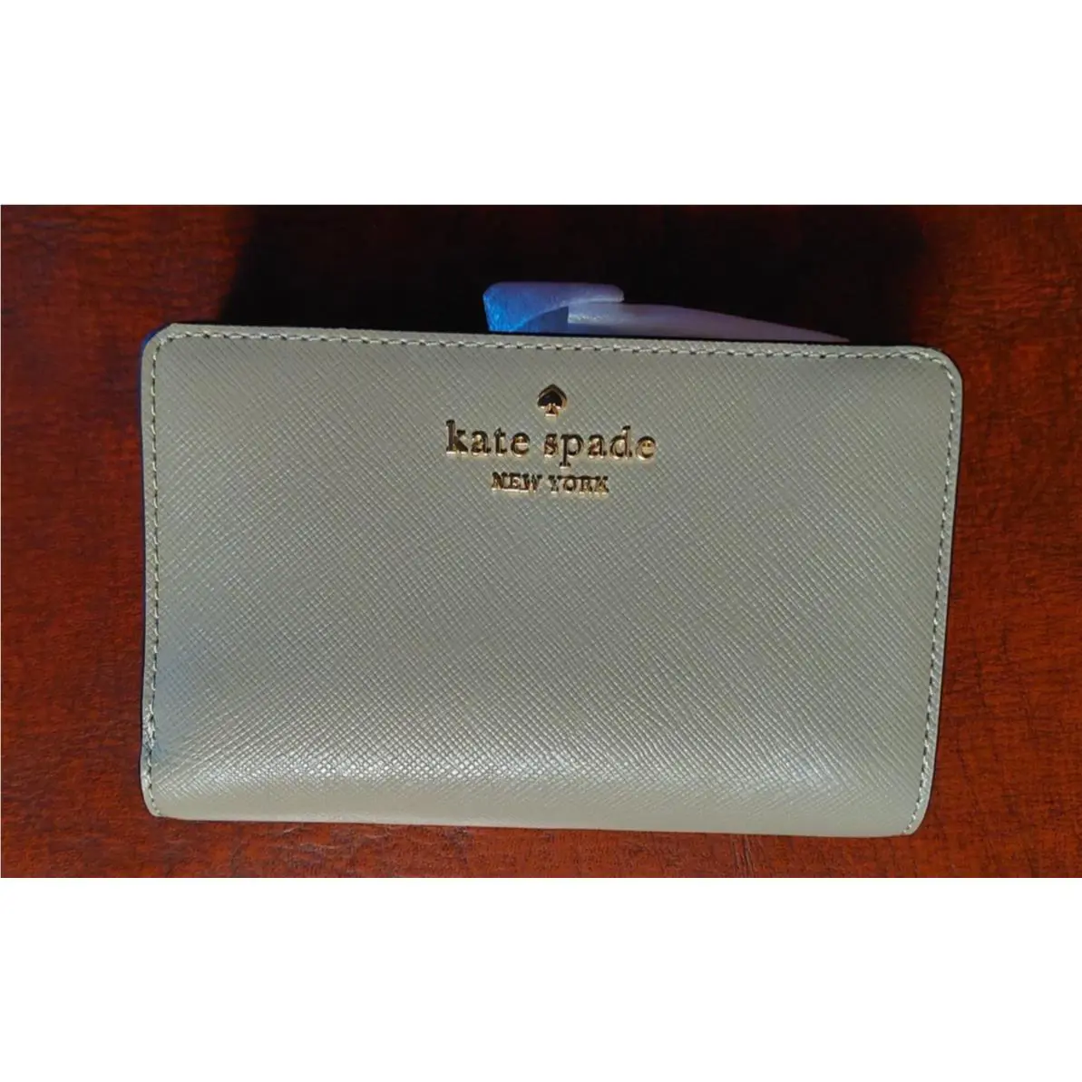 New Kate Spade Medium Bifold Wallet. Saffiano Leather. Color: Oyster