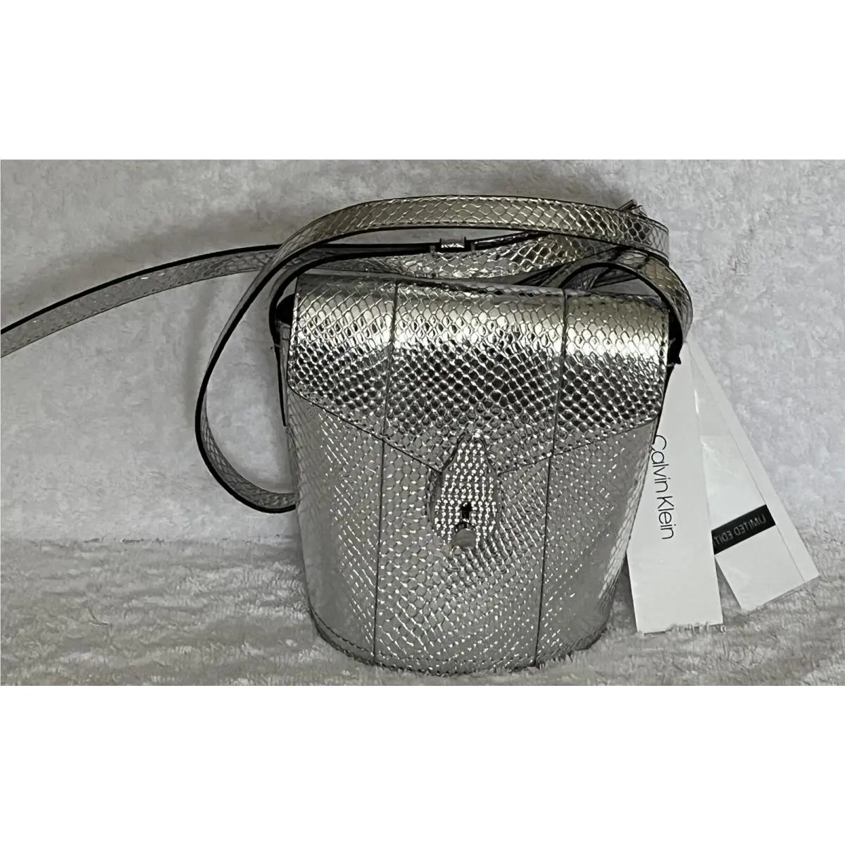 Calvin Klein Push Lock Series Silver Snake Embossed Mini Bucket Crossbody