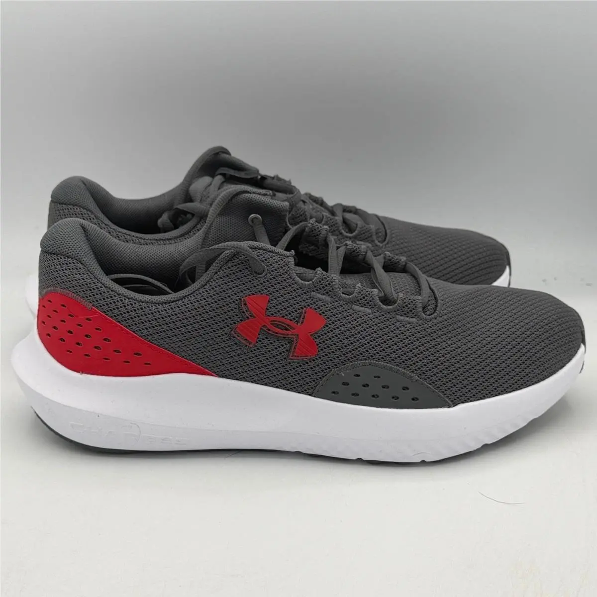 Under Armour Charged Surge 4 Shoes Mens 10.5 Grey Red Running 3027000 107