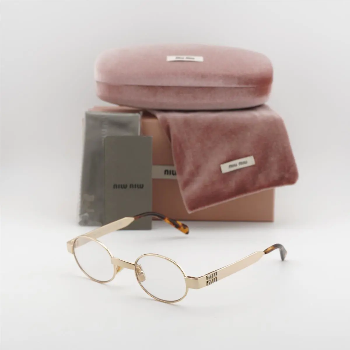 Miu Miu MUB51S 5AK10W Gold/clear 47-21-135 Sunglasses