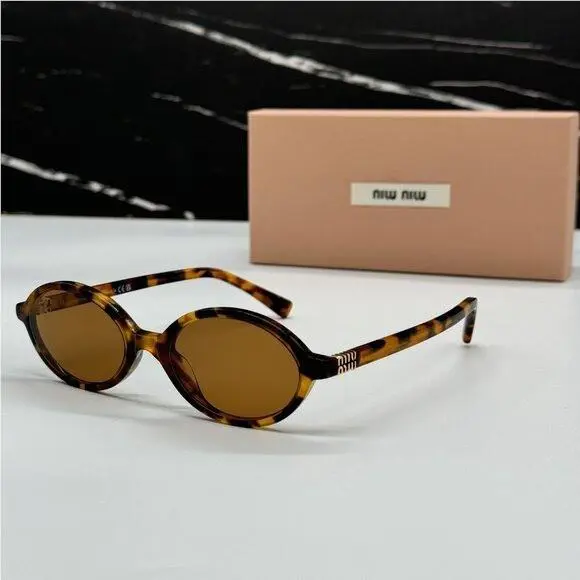 MU 04ZS Oval Havana Brown Sunglasses MU04ZS 19P2Z1 Women Miu Miu