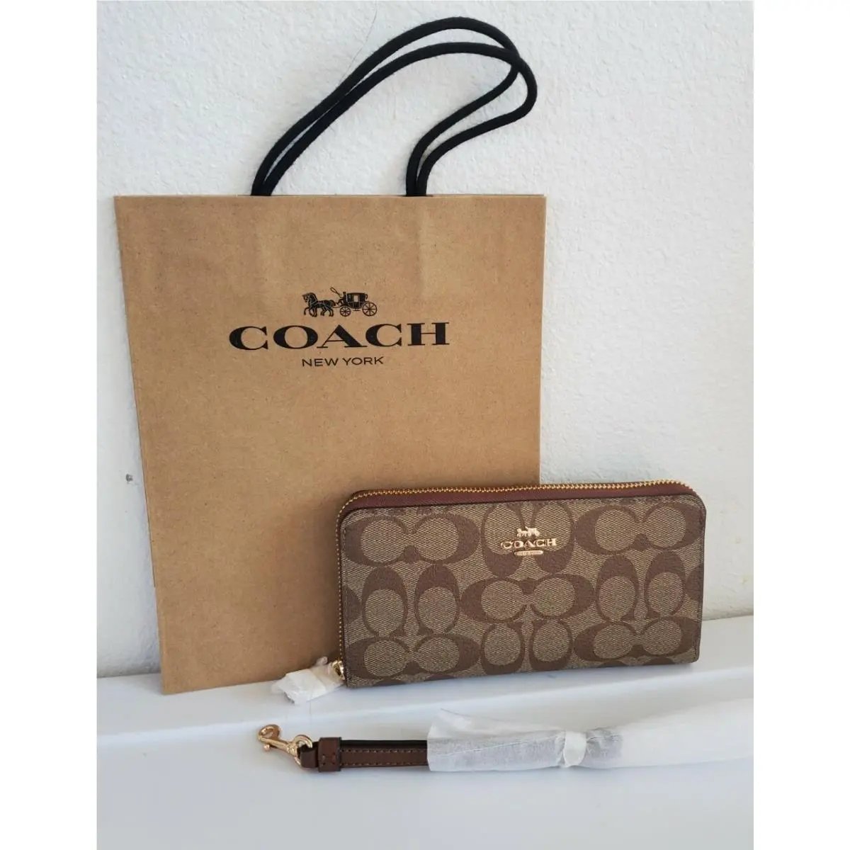 Coach Signature Long Zip Around Wallet In Signature Canvas Khaki/Saddle2C4452NWT