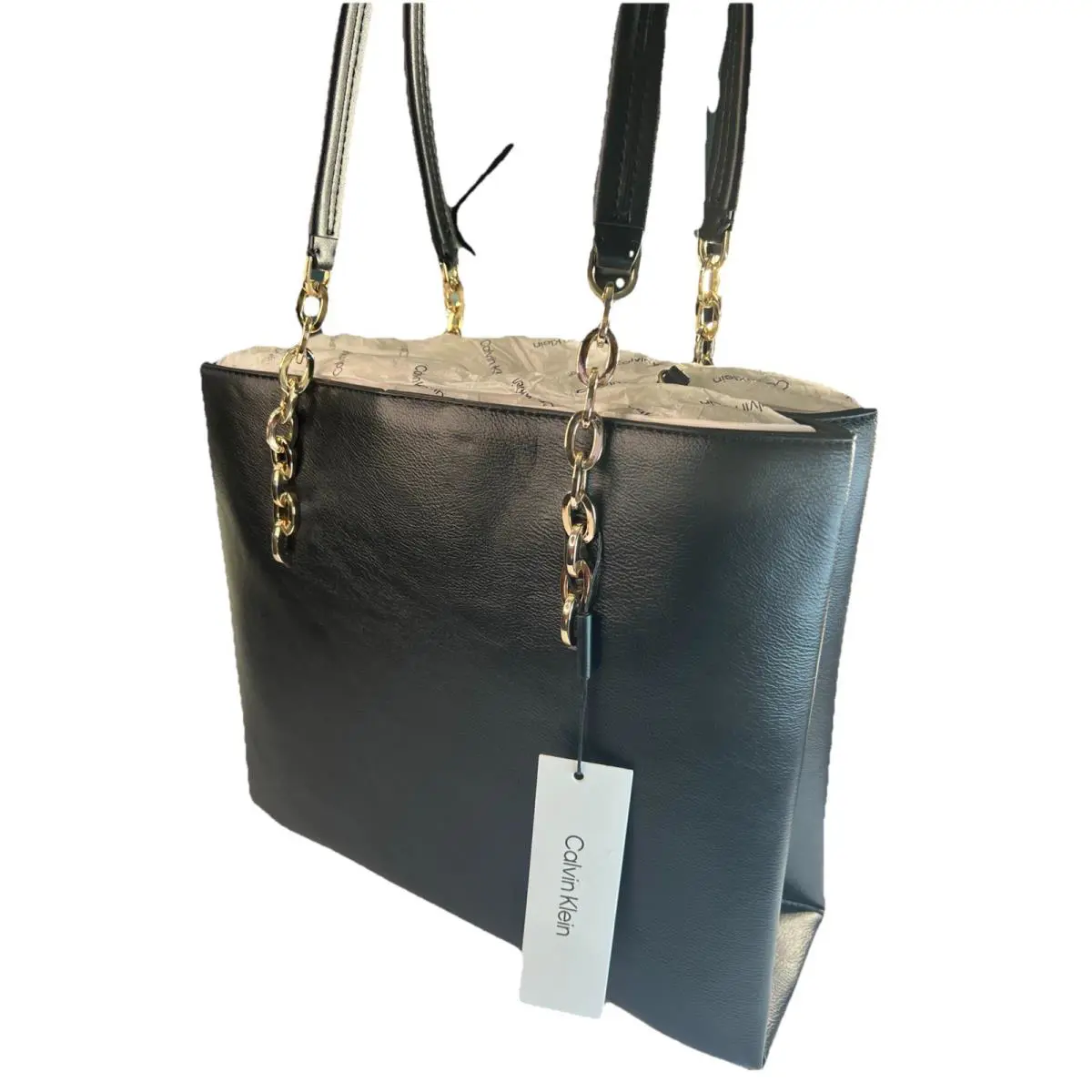 Calvin Klein Black Shoulder Bag. Gold Chain Accents. Zip Closure. Inner Pockets