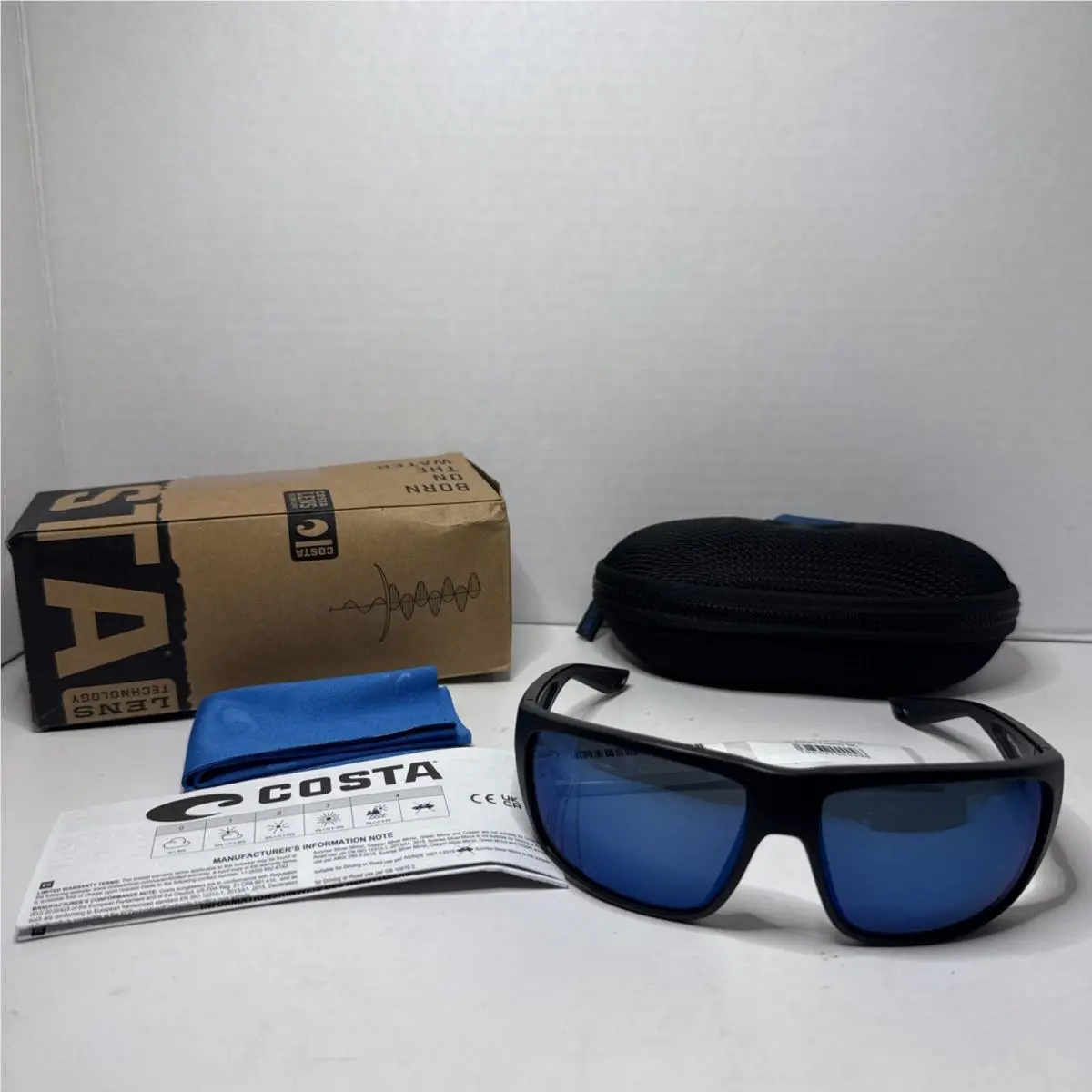 Fly Line Blue Polarized Glass Wrap Sunglasses 6S9129 64 13 120 3P by Costa Del Mar