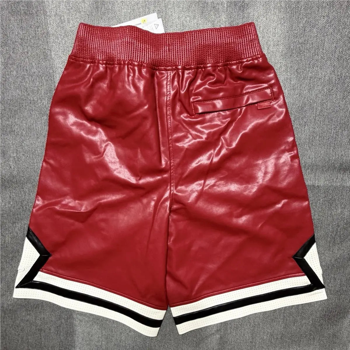 Nike clothing - Air Jordan Faux Leather Diamond Shorts - HV0077-659 - Wings Jordan Red (UPC: 198485234000) 1
