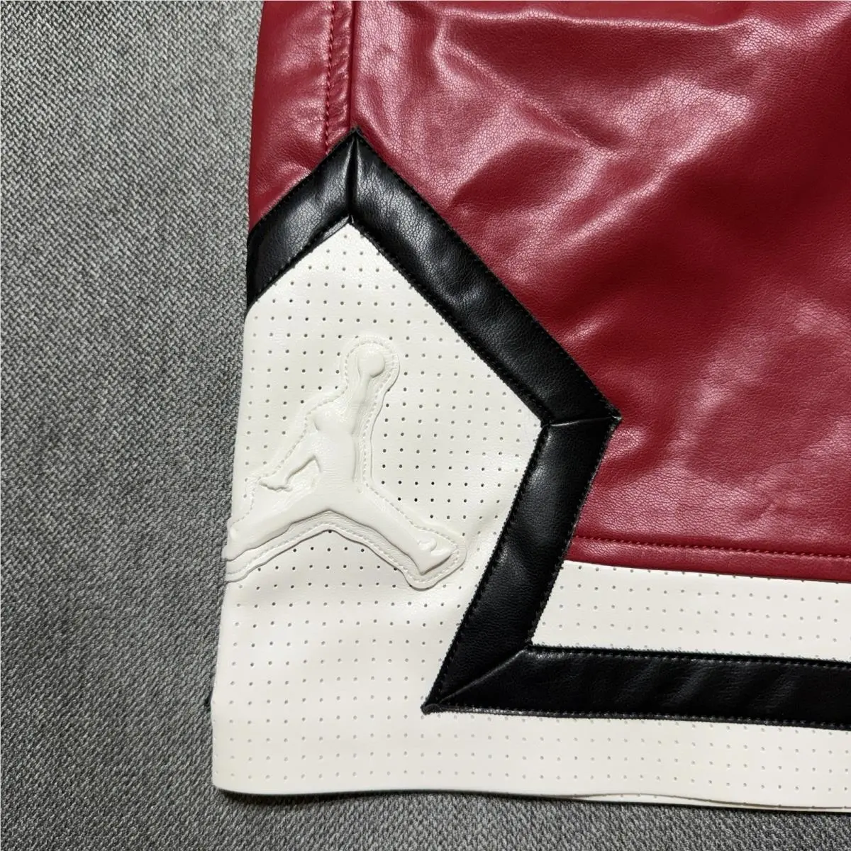 Nike clothing - Air Jordan Faux Leather Diamond Shorts - HV0077-659 - Wings Jordan Red (UPC: 198485234000) 2