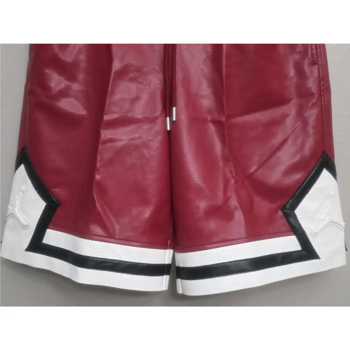 Nike clothing - Air Jordan Faux Leather Diamond Shorts - HV0077-659 - Wings Jordan Red (UPC: 198485197060) 1