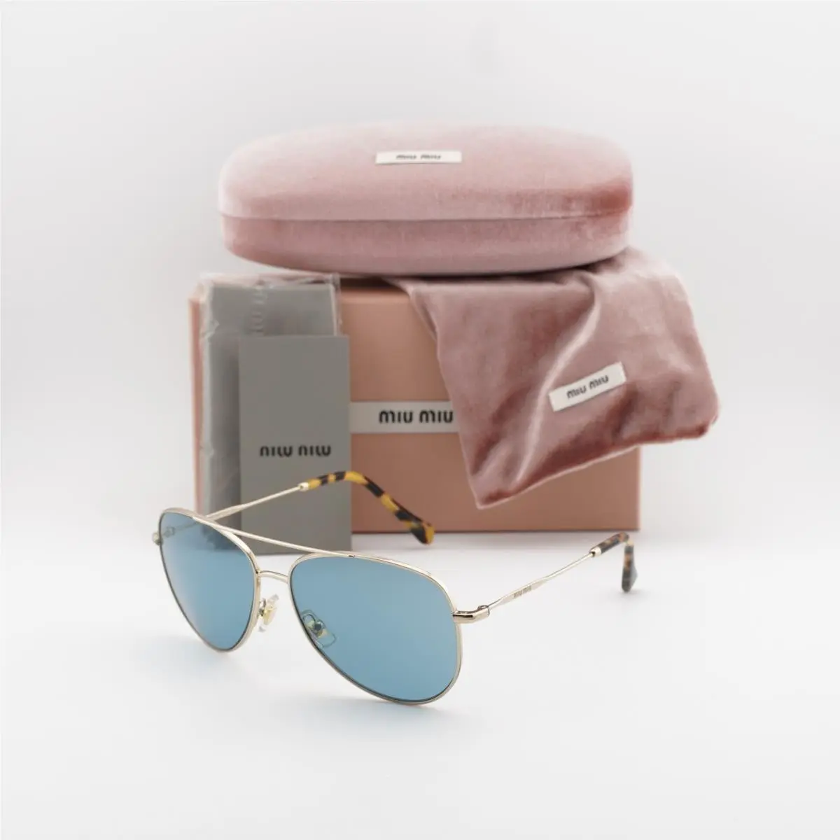 Miu Miu MU61US ZVN6P2 Gold/blue 57-17-140 Sunglasses