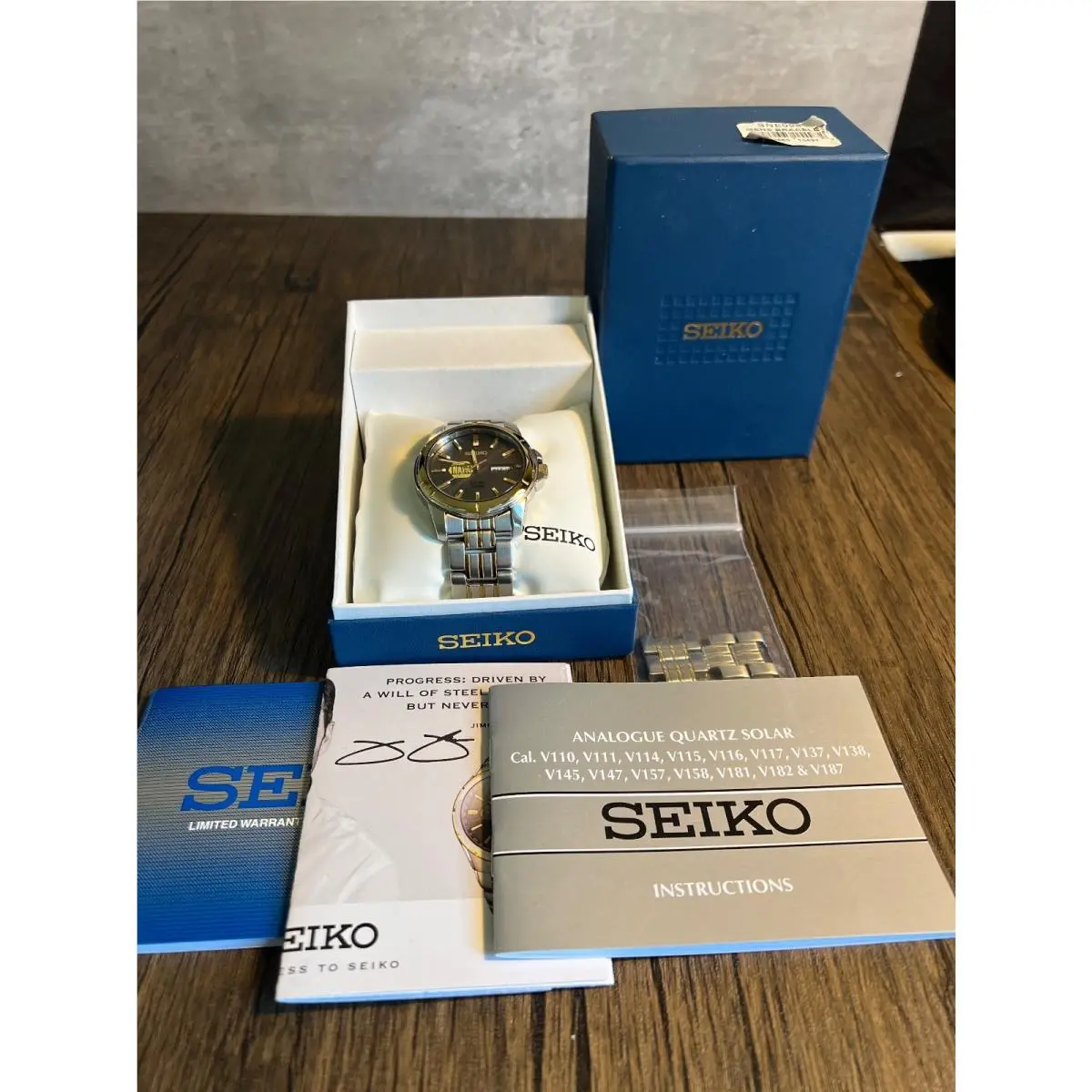 SNE098 Solar Men`s Watch Napa Auto Parts Logo Gray Dial Two Tone by Seiko