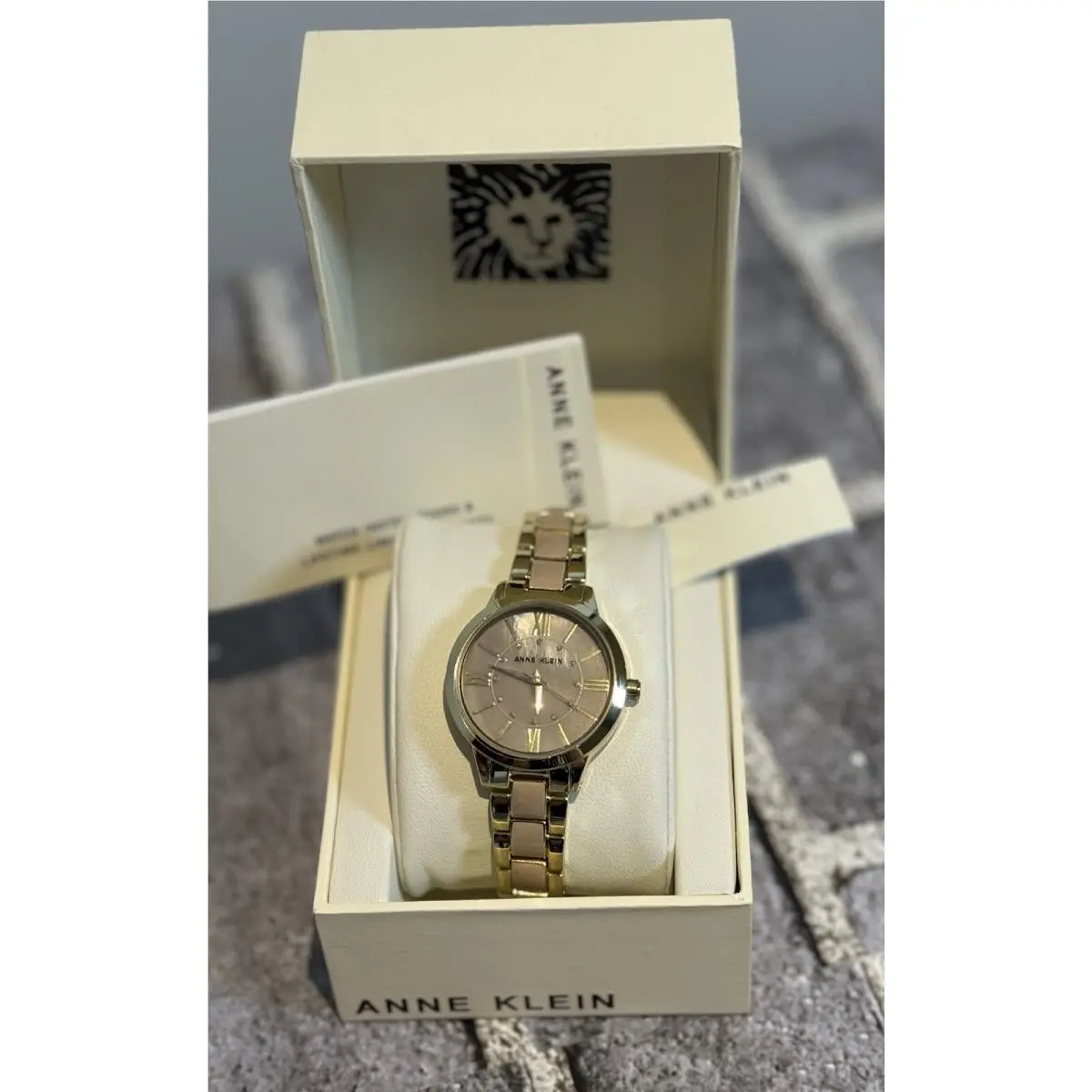 Anne Klein Women`s Gold-tone and Light Pink Resin Bracelet Watch