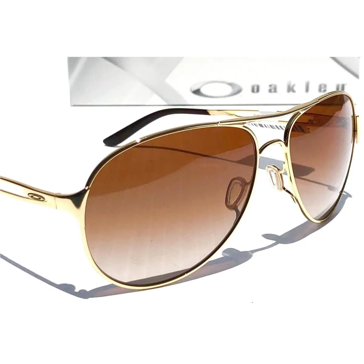 Oakley Women`s Aviator Caveat Gold 60mm VR50 Brown Lens Sunglass 4054-07