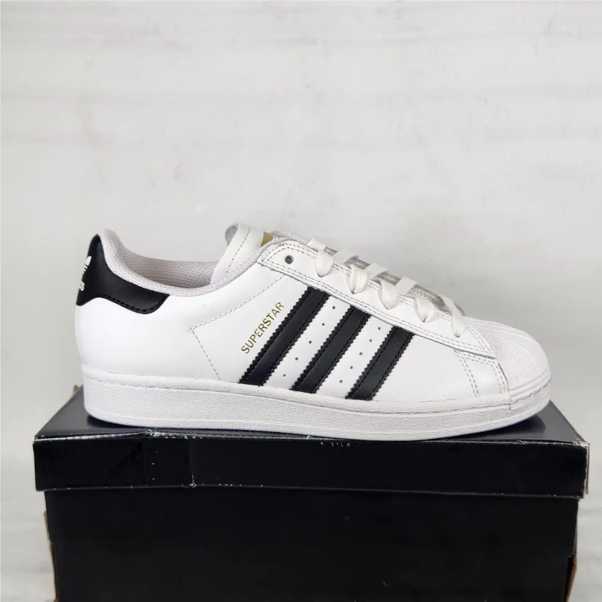 6 Men- Adidas Superstar Adv - Cloud White / Core Black / Gold Logo - GW6930