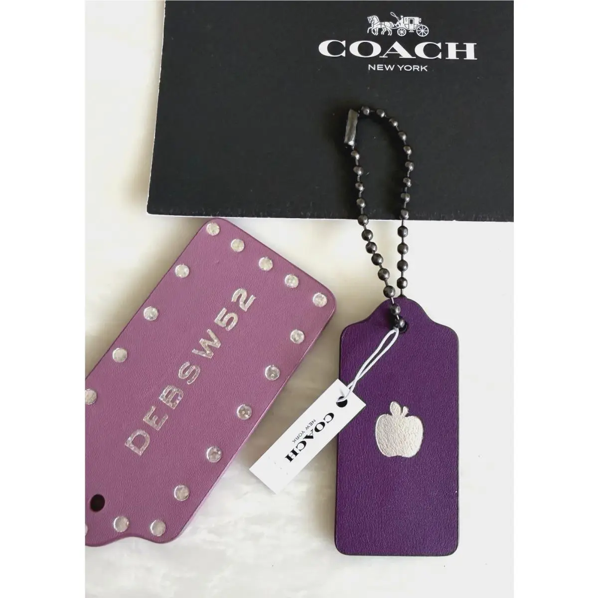 Coach Aubergine Leather Hangtag Metallic Silver Apple Stamp Bag Charm 55703G
