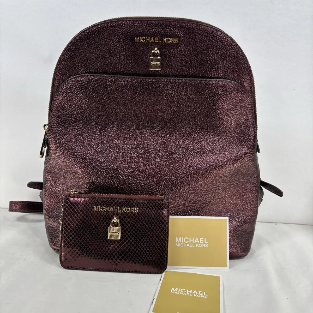 Michael Kors Bags Adele Large Dome Backpack in Metallic Burgundy Pebbled Leather