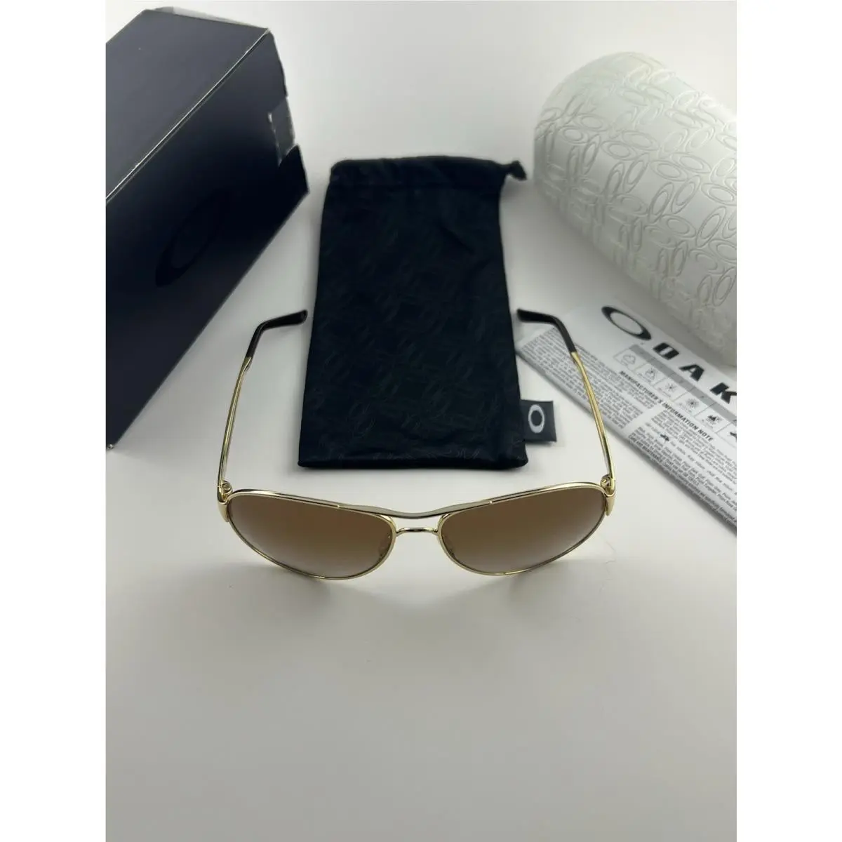 Oakley Caveat Polished Gold Dark Brown Gradient+box OO4054-07 Womens