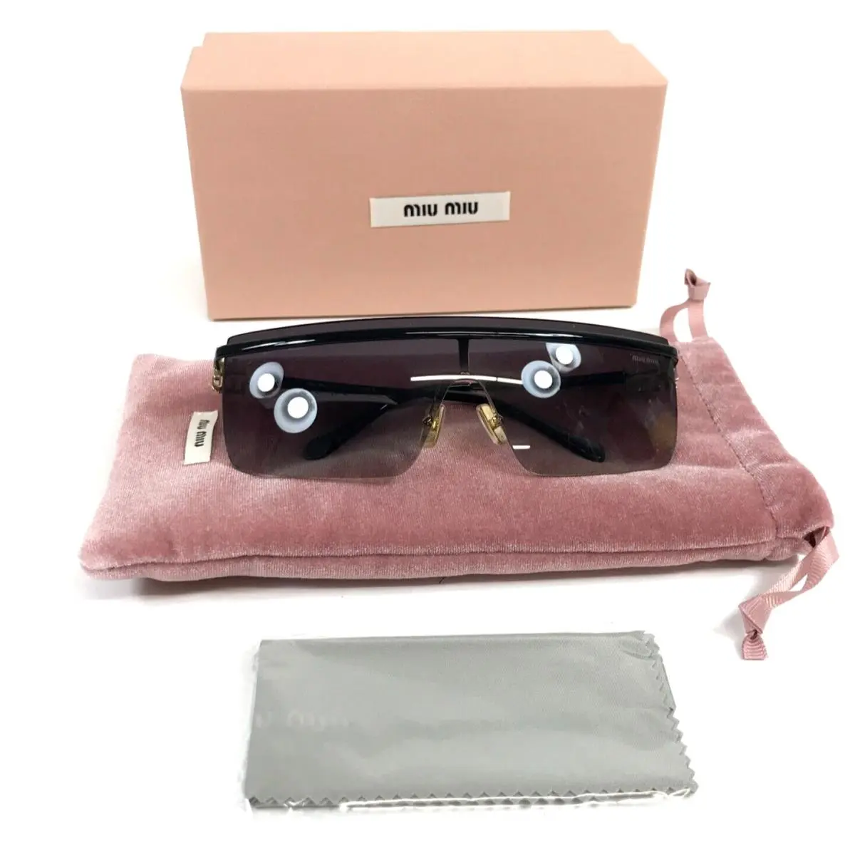 Sunglasses SMU50Z 1AB-5D1 Polished Black Frames with Gray Gradient Lens by Miu Miu