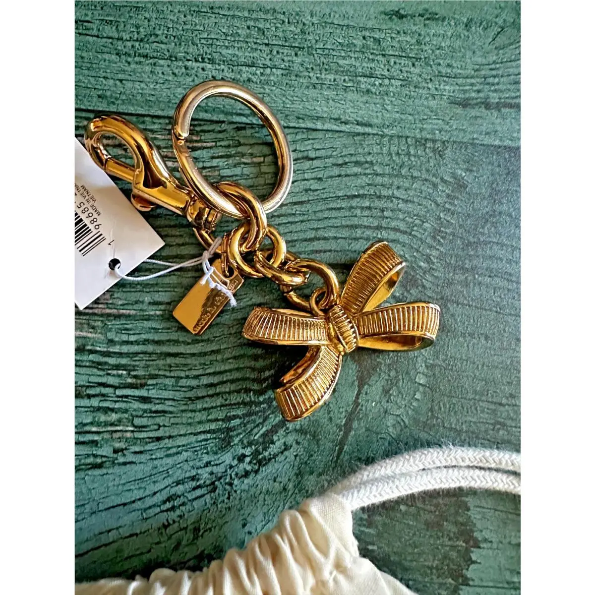 Coach CEM83 Bow Bag Charm Gold/gold CEM83 with Dust Bag