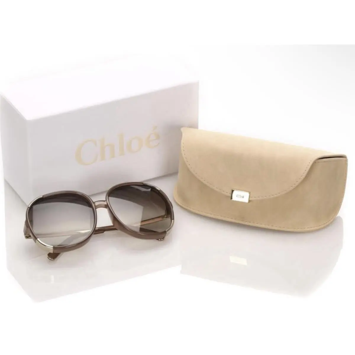 Chloé CE712S Sunglasses Feature a Distinct Brown and Gold Oversized Round Frame