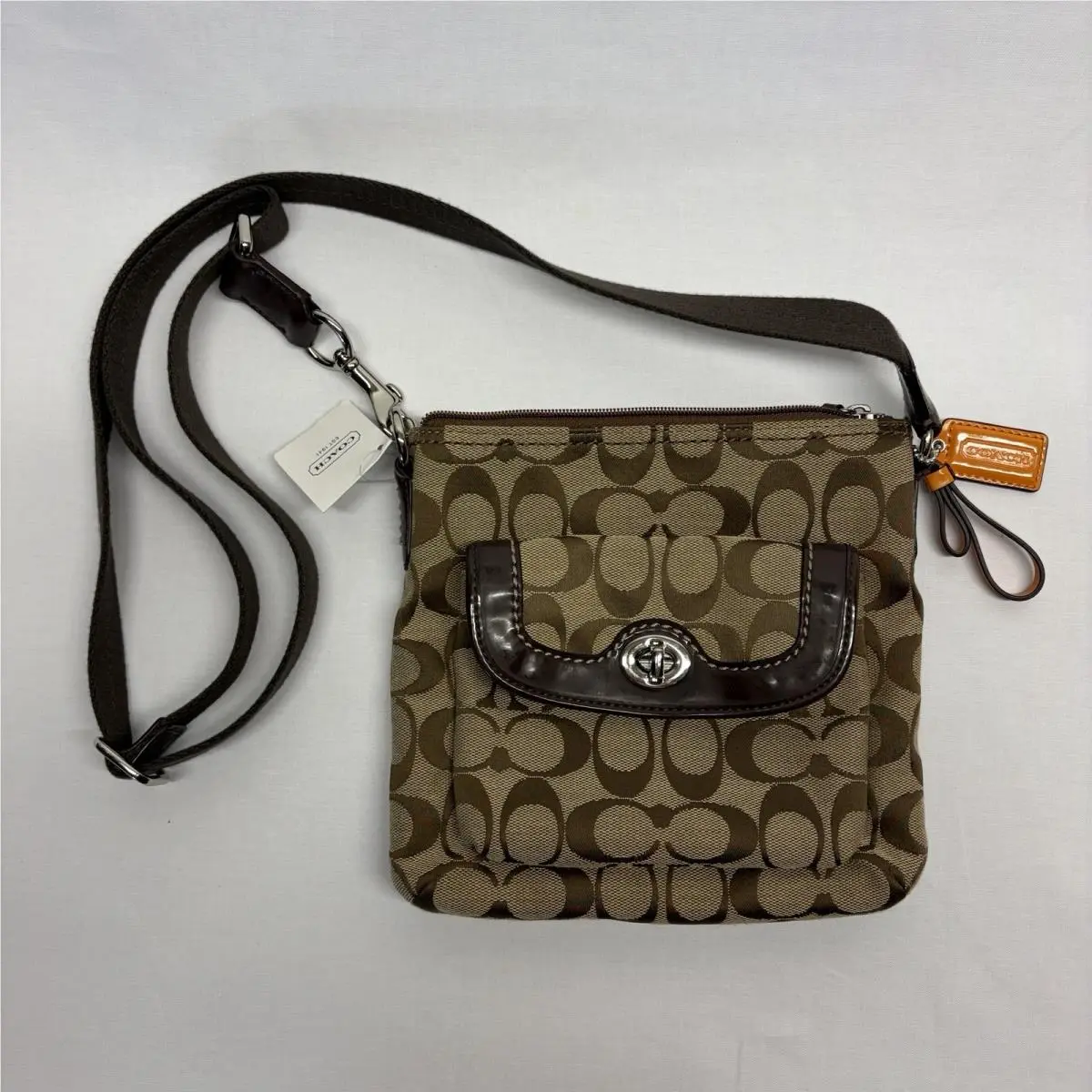 Coach Signature Jacquard Swingpack Crossbody Bag Khaki Mahogany F49148