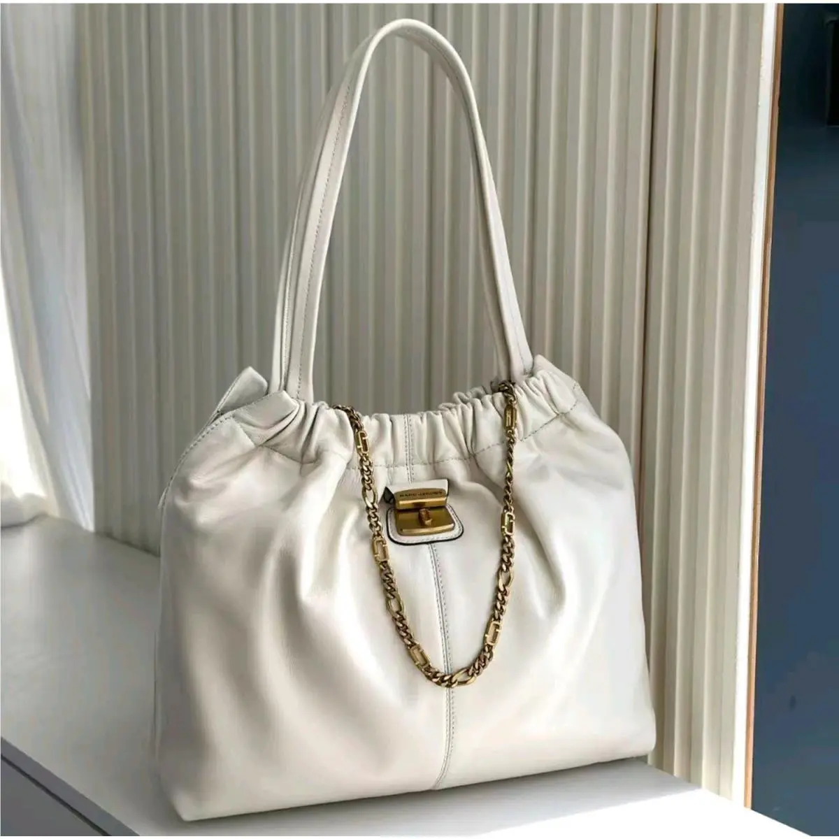The Cristina Chain-embellished Drawstring Leather Tote Ivory OS by Marc Jacobs