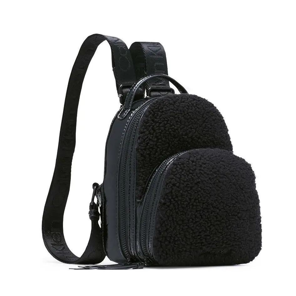 Calvin Klein Astatine Sherpa Trim and Patent Leather Mini Backpack in Black