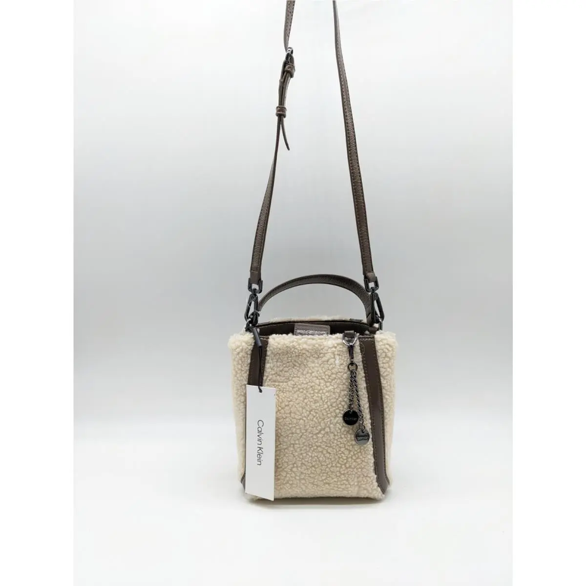 Calvin Klein Astatine Sherpa Trimpatent Leather Mini Crossbody in Taupe Beige