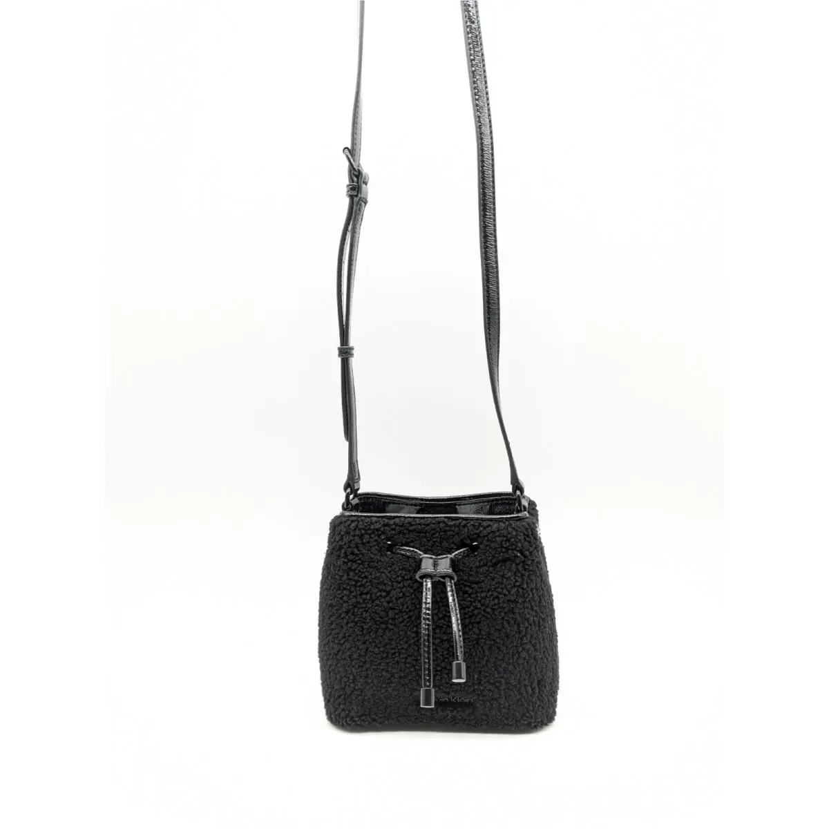 Calvin Klein Astatine Sherpa Trim Patent Leather Bucket Mini Crossbody in Black
