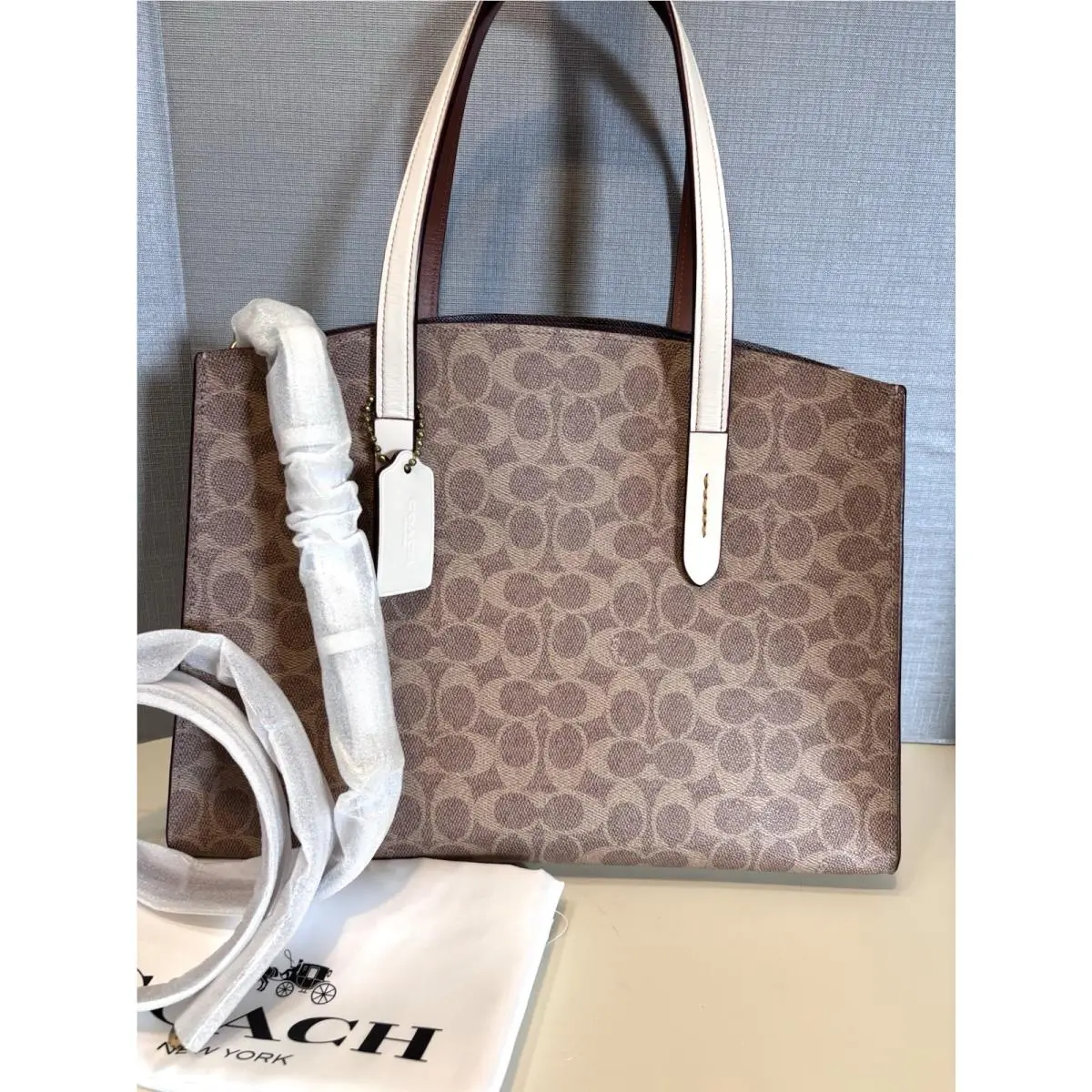 Coach Charlie Carryall in Signature Coated Canvas Chalk Tan 31210