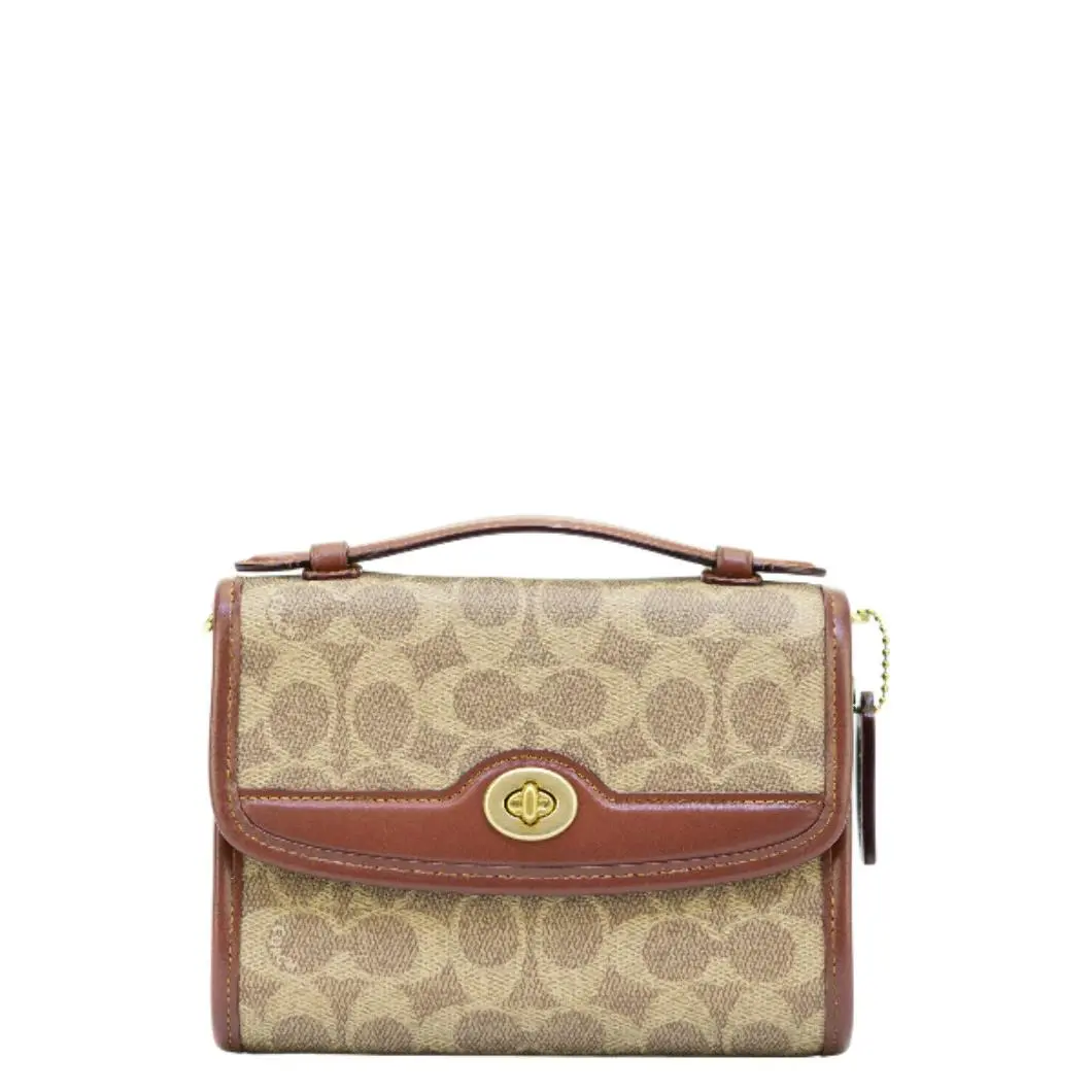 Coach Kip Turnlock Crossbody In Signature Canvas - Tan/rust