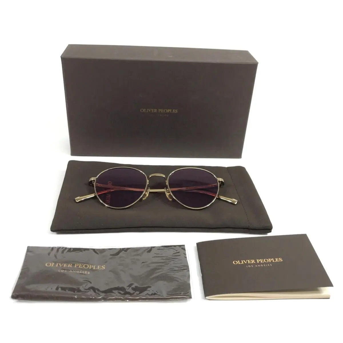 Sunglasses OV1336ST 50353E Rhydian Gold Magenta Photochromic Lens by Oliver Peoples