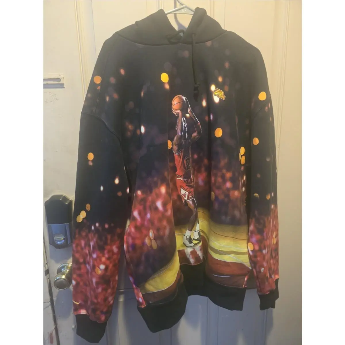 This Black Nike Air Jordan Jumpman Pullover Hoodie Features A Vivid Graphic OF