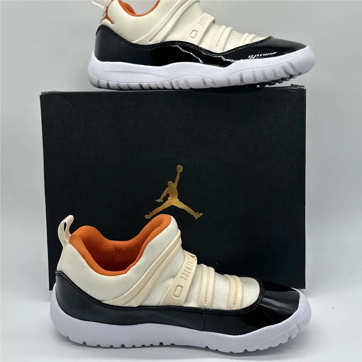 Nike shoes - Air Jordan 11 - Air - Black, White, Orange (UPC: 0193151910929) 1